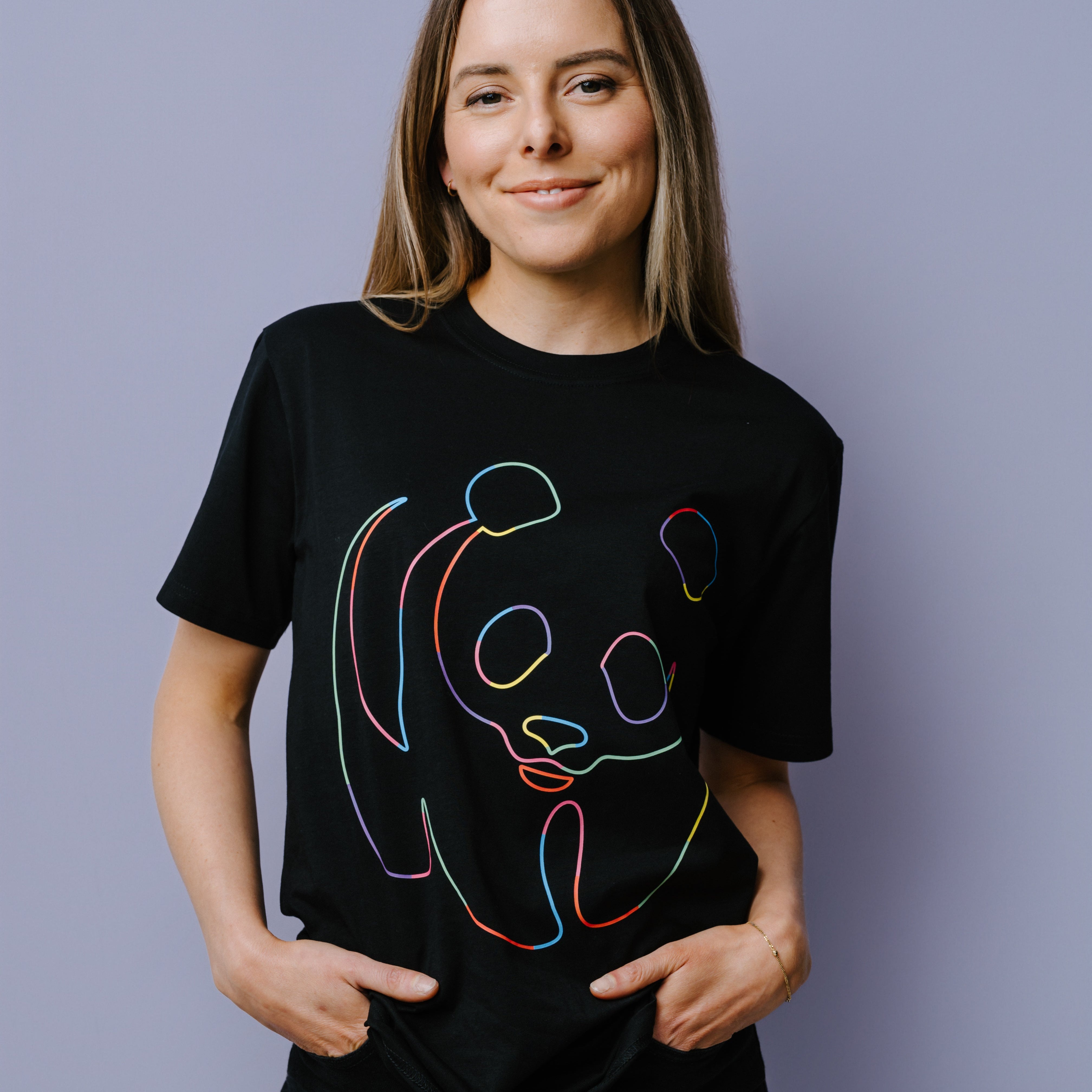 Person wearing a black t-shirt with rainbow WWF panda logo design on a plain background.