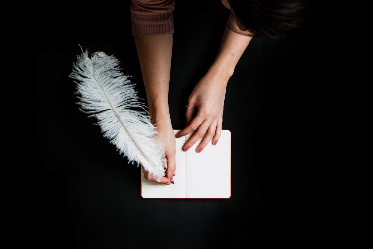 Women writing a card, to show easy ecard gift set up